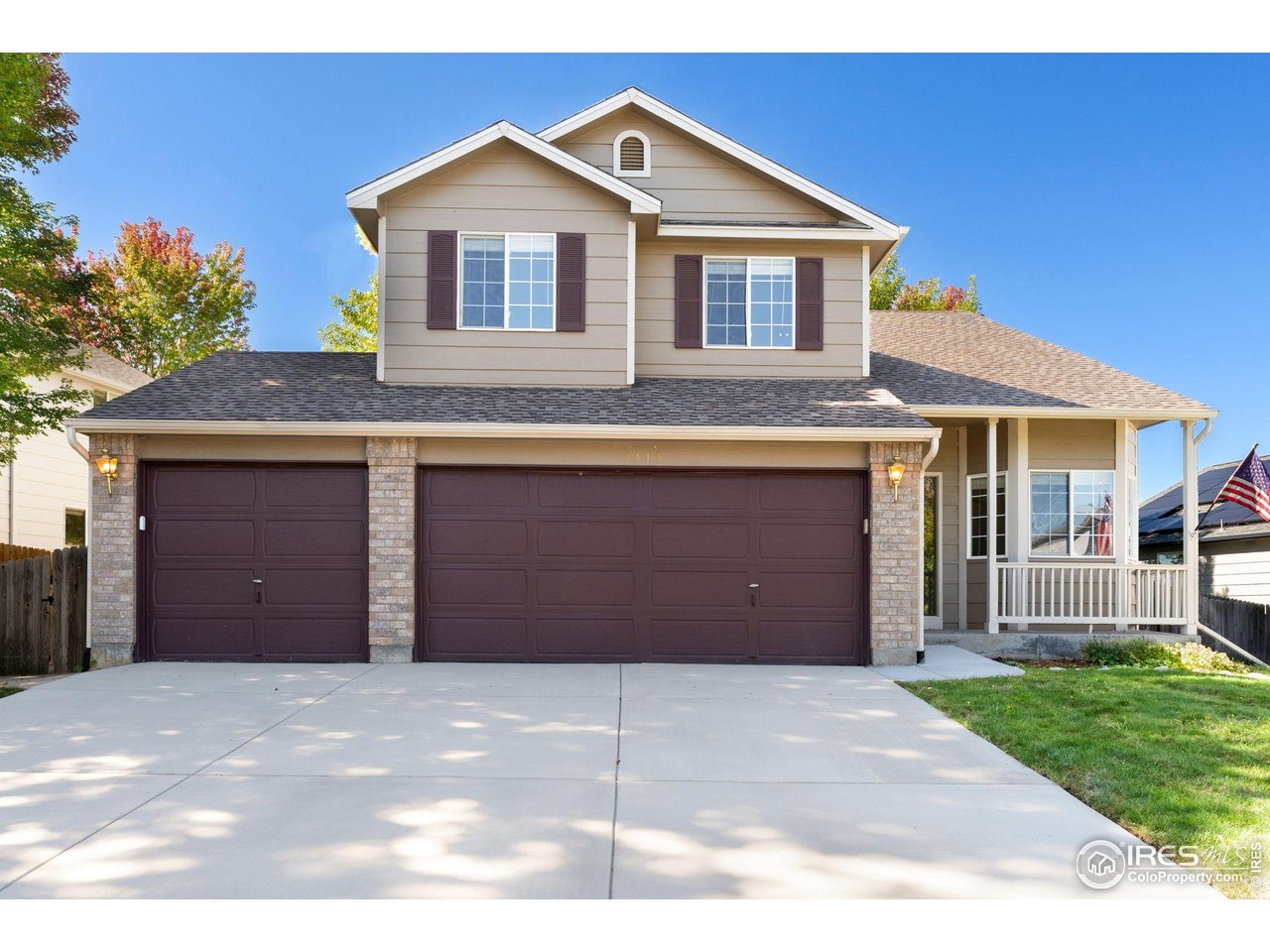 5415 Wolf Street Frederick, CO 80504 - Photo 3 of 29 a front view of a house with a garage