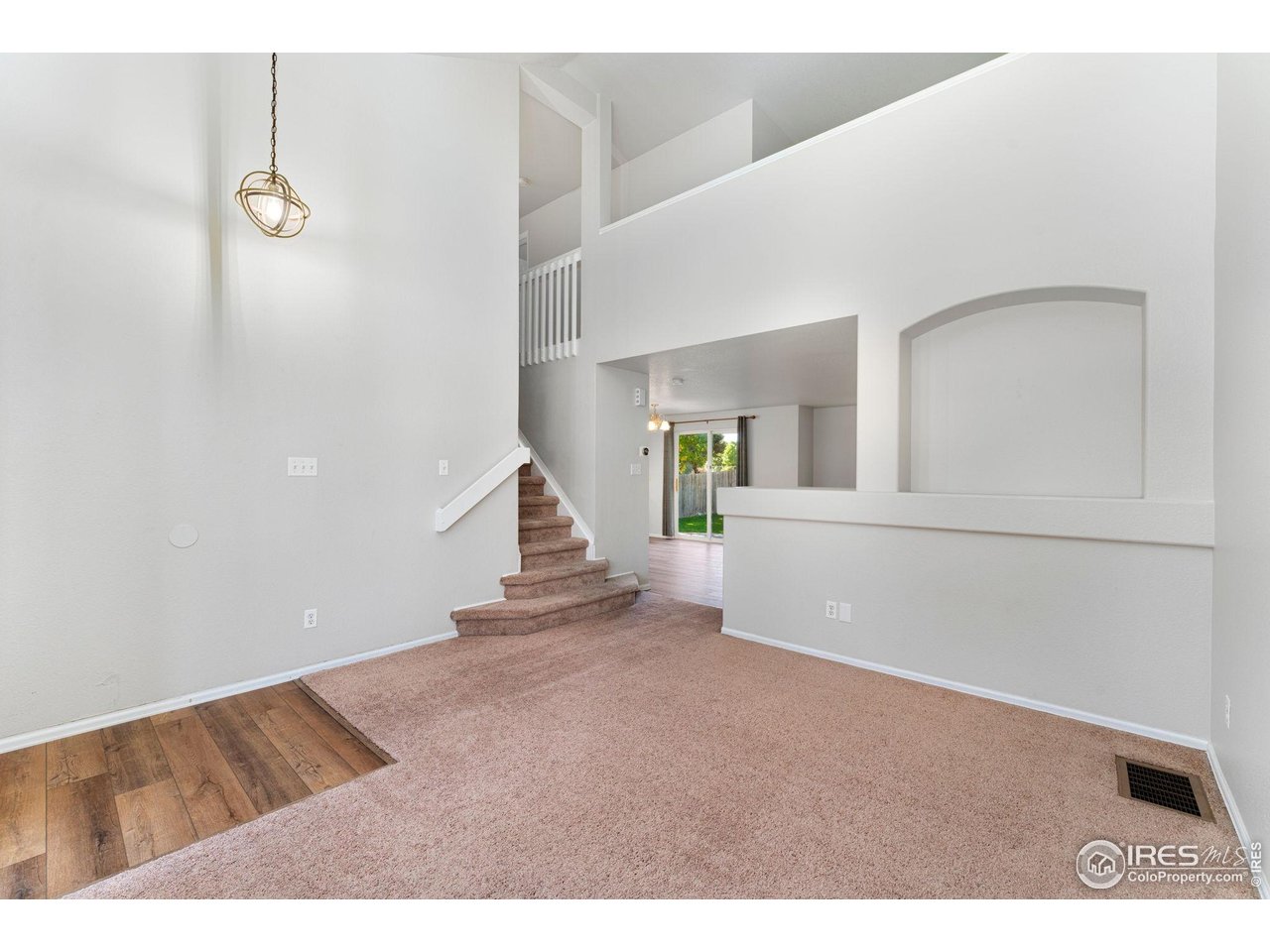 5415 Wolf Street Frederick, CO 80504 - Photo 7 of 29 a view of an empty room with stairs