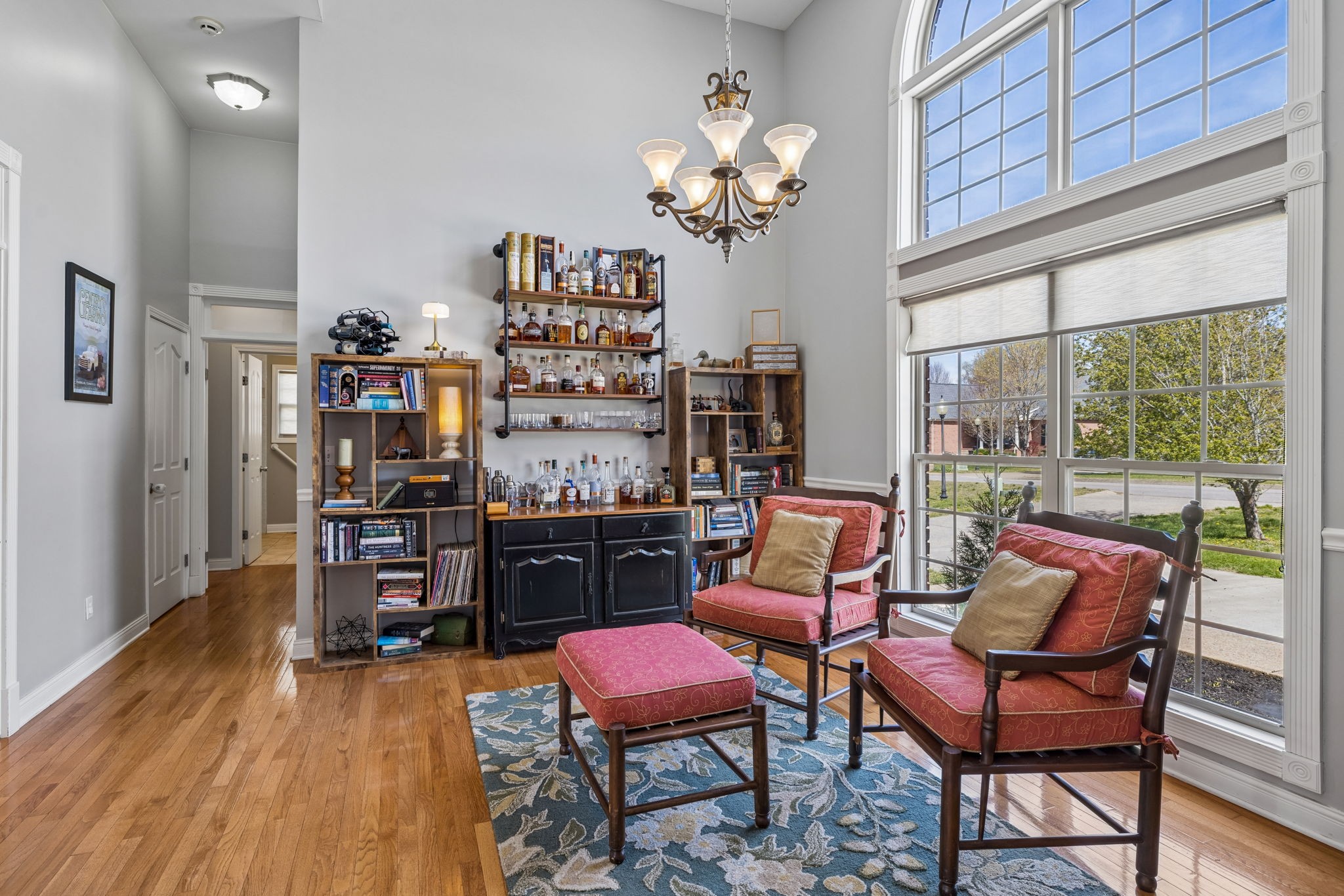 1062 Kacie Drive Pleasant View, TN 37146 - Photo 11 of 67 a living room with furniture a chandelier and a floor to ceiling window