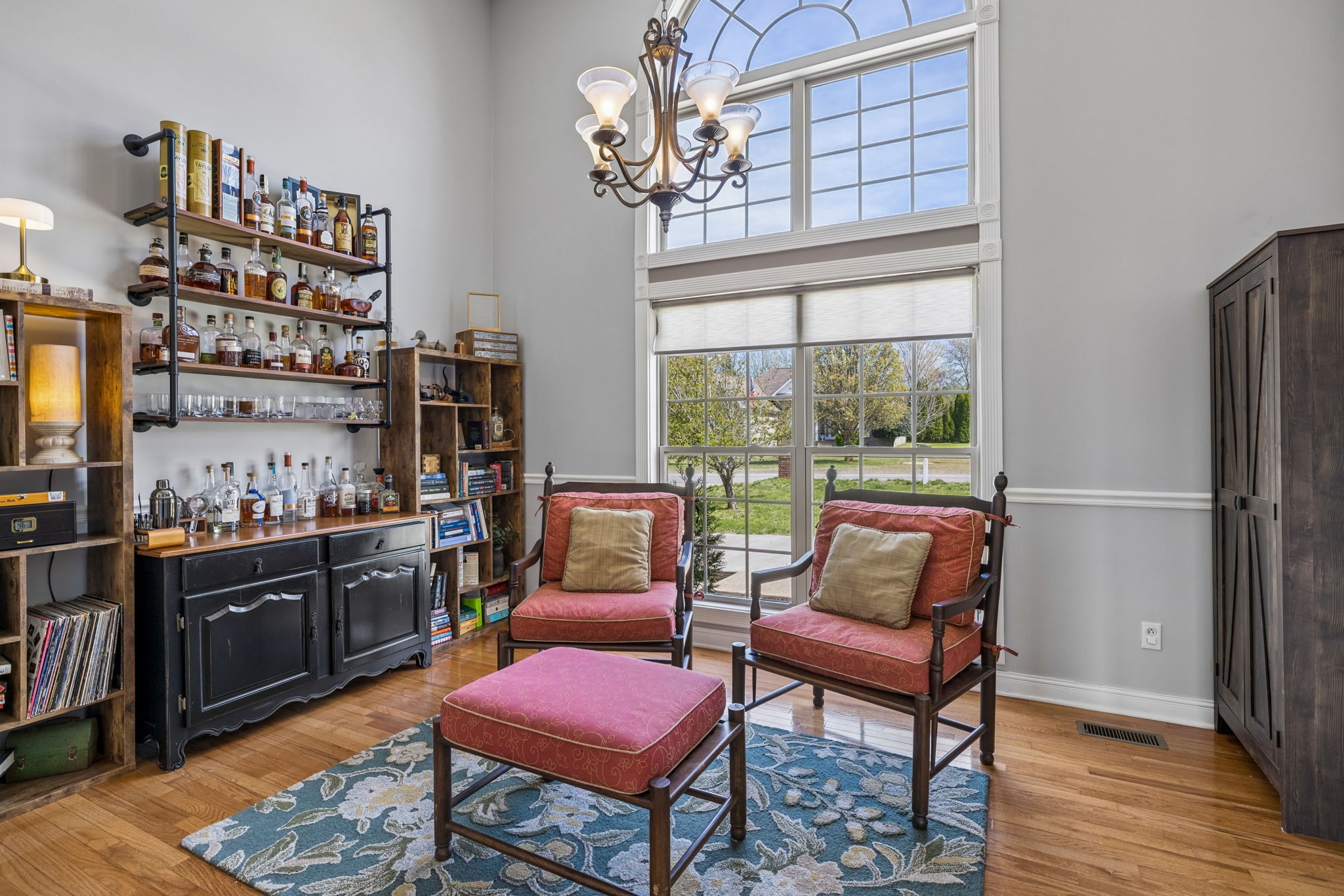 1062 Kacie Drive Pleasant View, TN 37146 - Photo 12 of 67 a living room with furniture a rug and a chandelier