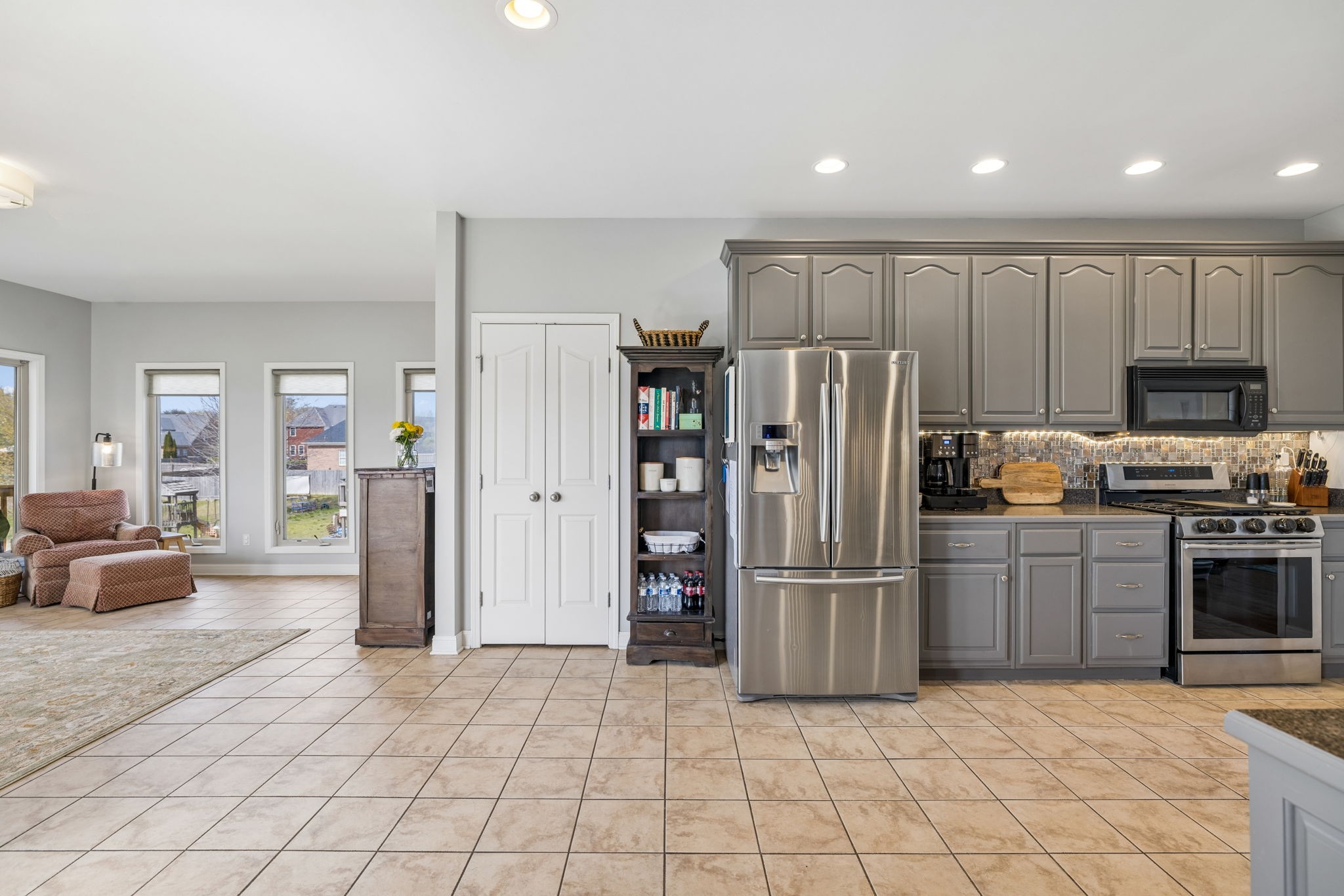 1062 Kacie Drive Pleasant View, TN 37146 - Photo 24 of 67 a kitchen with stainless steel appliances granite countertop a refrigerator and a stove top oven