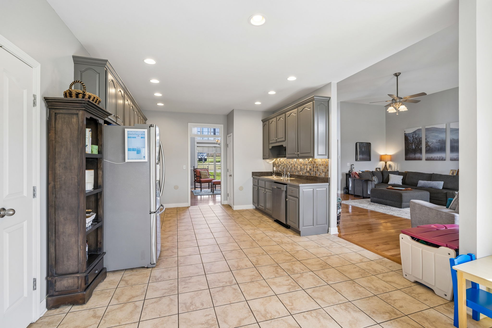 1062 Kacie Drive Pleasant View, TN 37146 - Photo 29 of 67 a large open kitchen with a refrigerator and a stove top oven