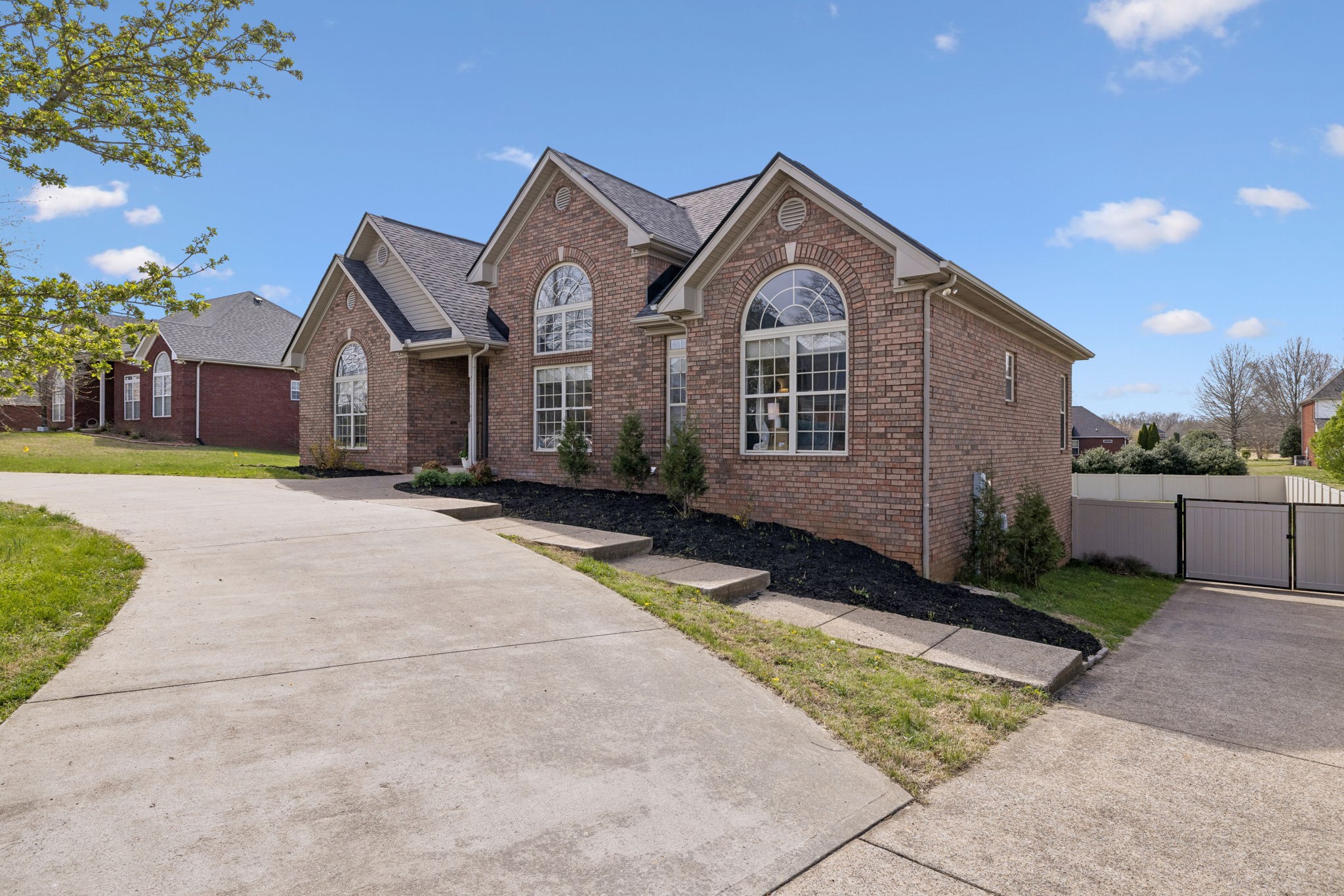 1062 Kacie Drive Pleasant View, TN 37146 - Photo 3 of 67 a front view of a house with a yard and garage