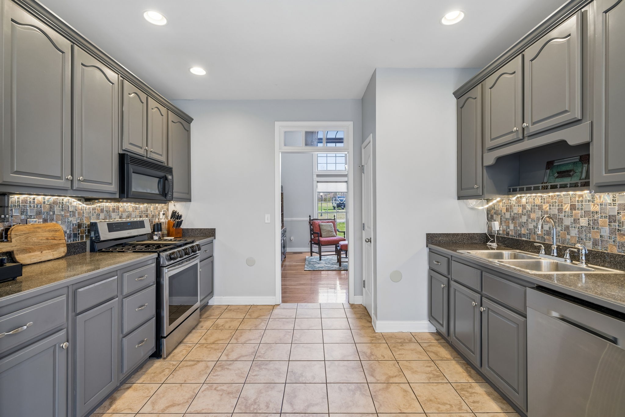 1062 Kacie Drive Pleasant View, TN 37146 - Photo 32 of 67 a kitchen with stainless steel appliances granite countertop a stove sink and cabinets