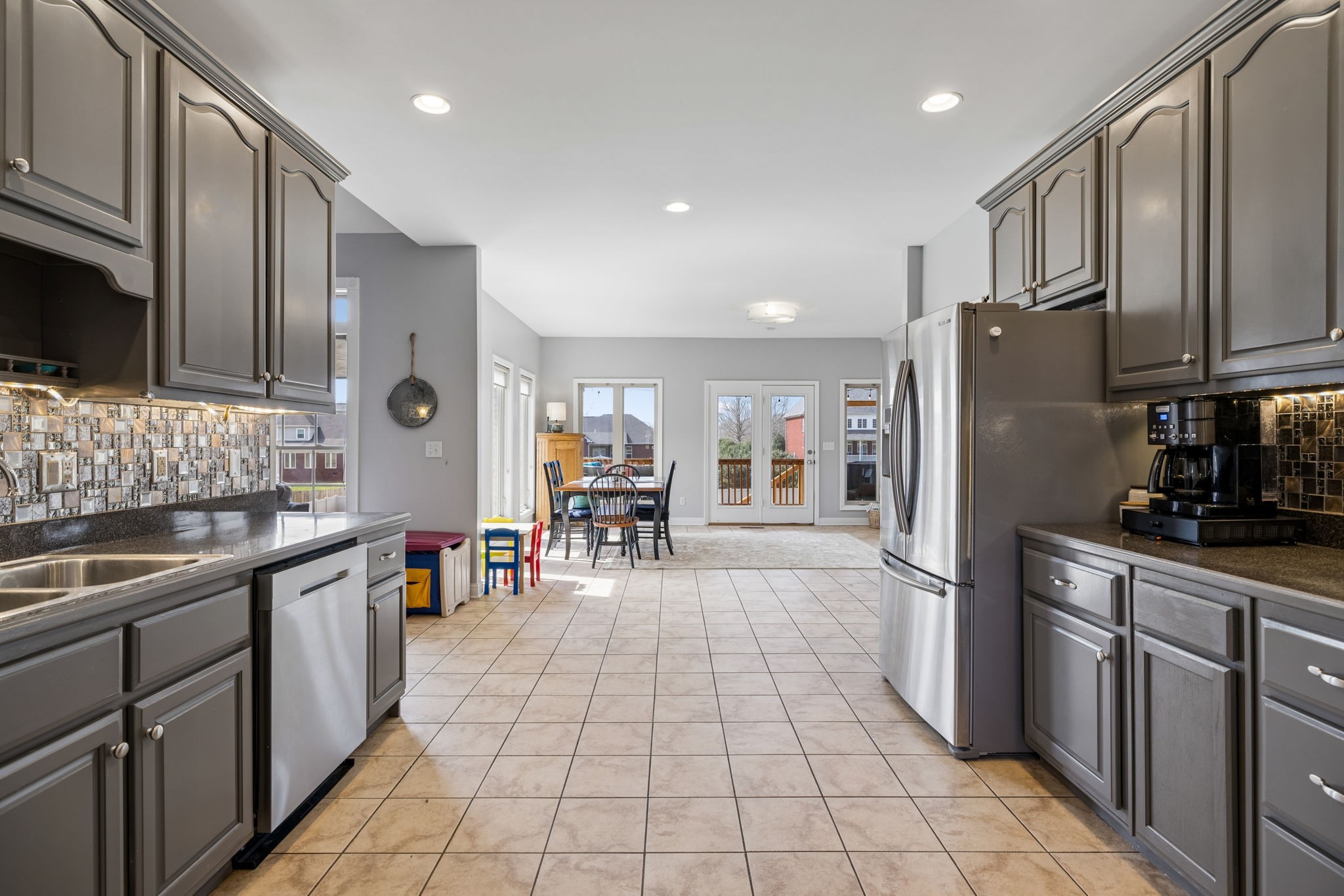 1062 Kacie Drive Pleasant View, TN 37146 - Photo 35 of 67 a kitchen with stainless steel appliances granite countertop a refrigerator and a stove top oven