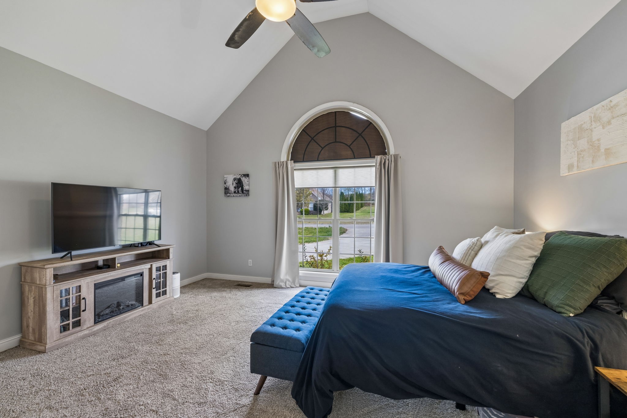 1062 Kacie Drive Pleasant View, TN 37146 - Photo 39 of 67 a bedroom with a bed and a flat screen tv