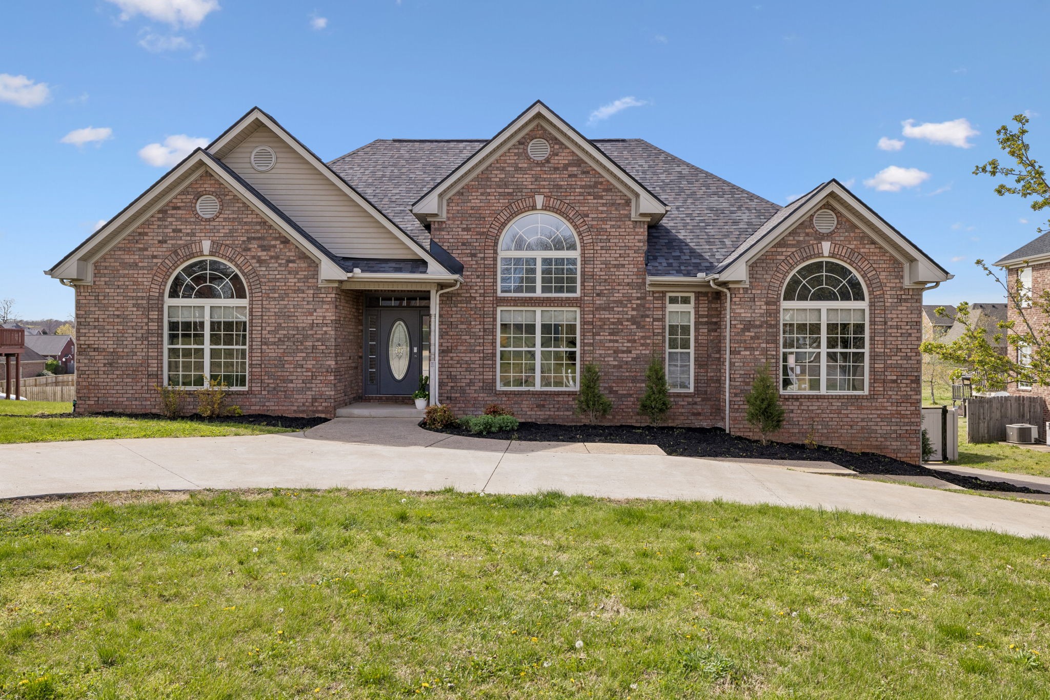 1062 Kacie Drive Pleasant View, TN 37146 - Photo 4 of 67 a front view of a house with a garden