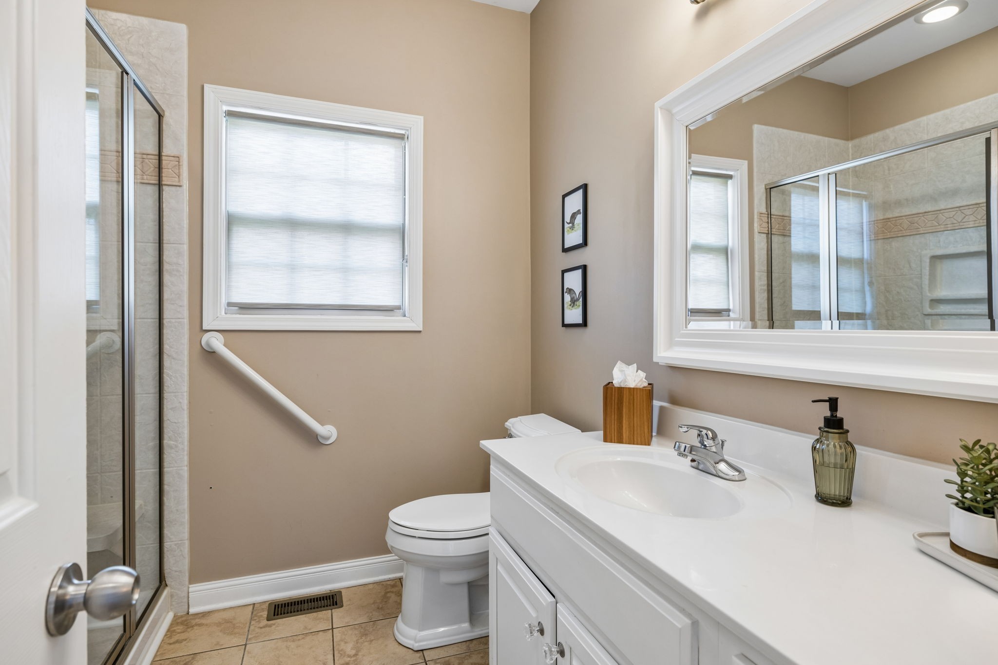 1062 Kacie Drive Pleasant View, TN 37146 - Photo 45 of 67 a bathroom with a toilet sink and mirror