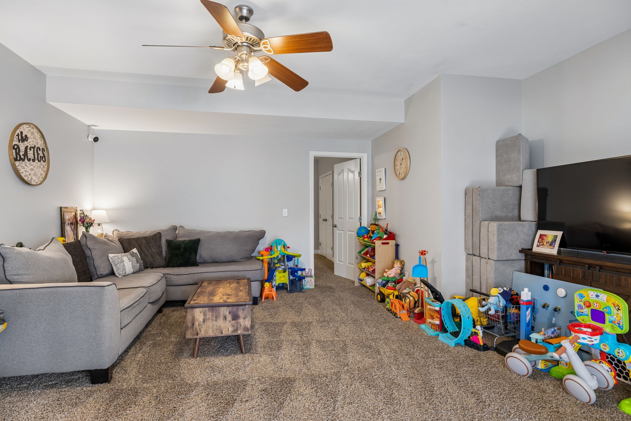 1062 Kacie Drive Pleasant View, TN 37146 - Photo 48 of 67 a living room with furniture and a flat screen tv