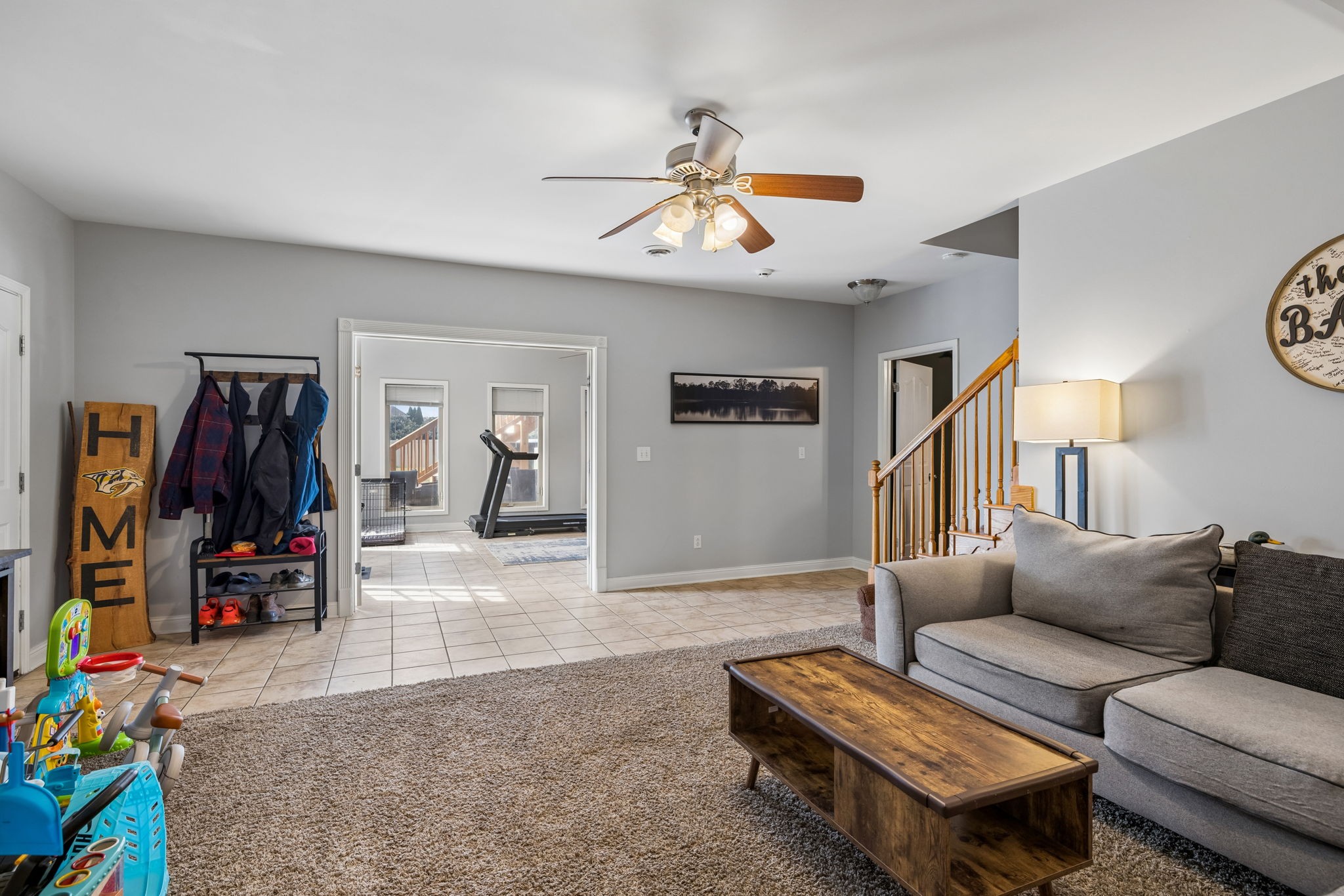 1062 Kacie Drive Pleasant View, TN 37146 - Photo 49 of 67 a living room with furniture a ceiling fan and a window