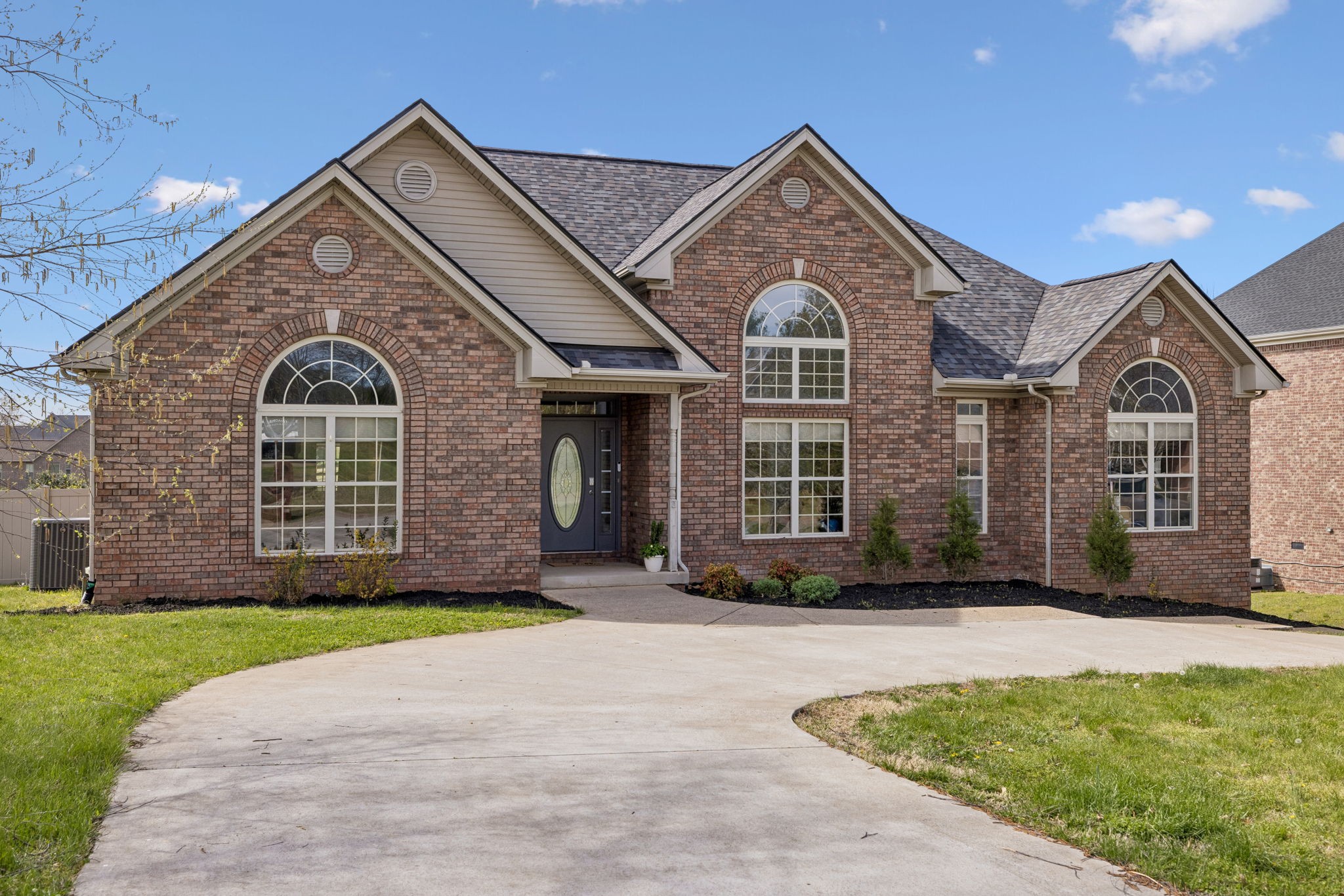 1062 Kacie Drive Pleasant View, TN 37146 - Photo 5 of 67 a front view of a house with a yard