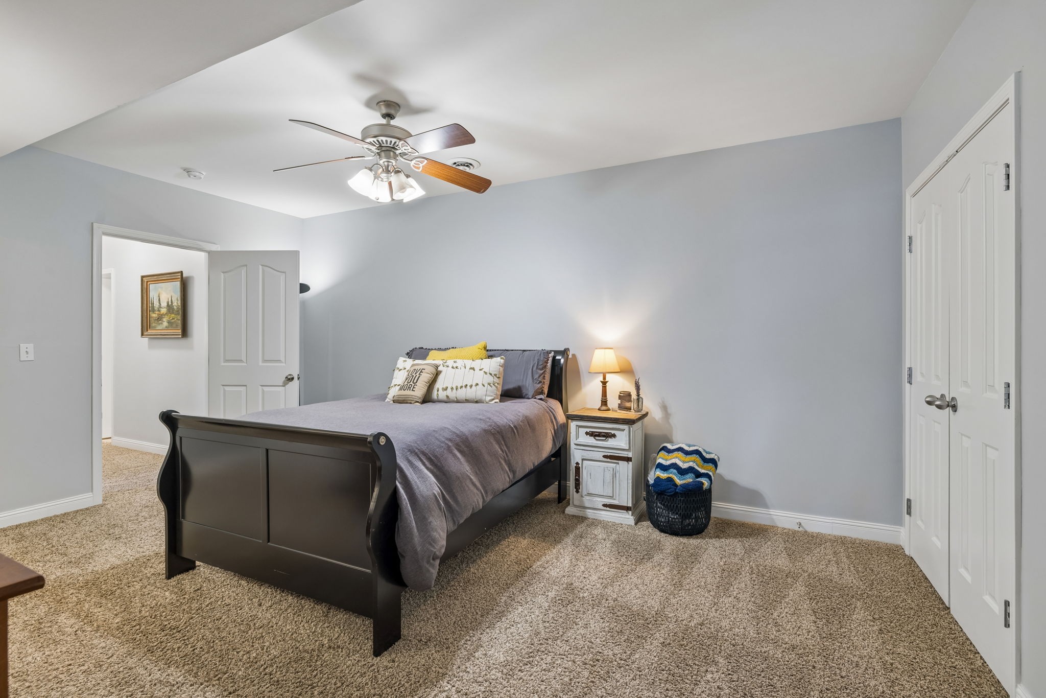 1062 Kacie Drive Pleasant View, TN 37146 - Photo 52 of 67 a bedroom with a bed and a chandelier