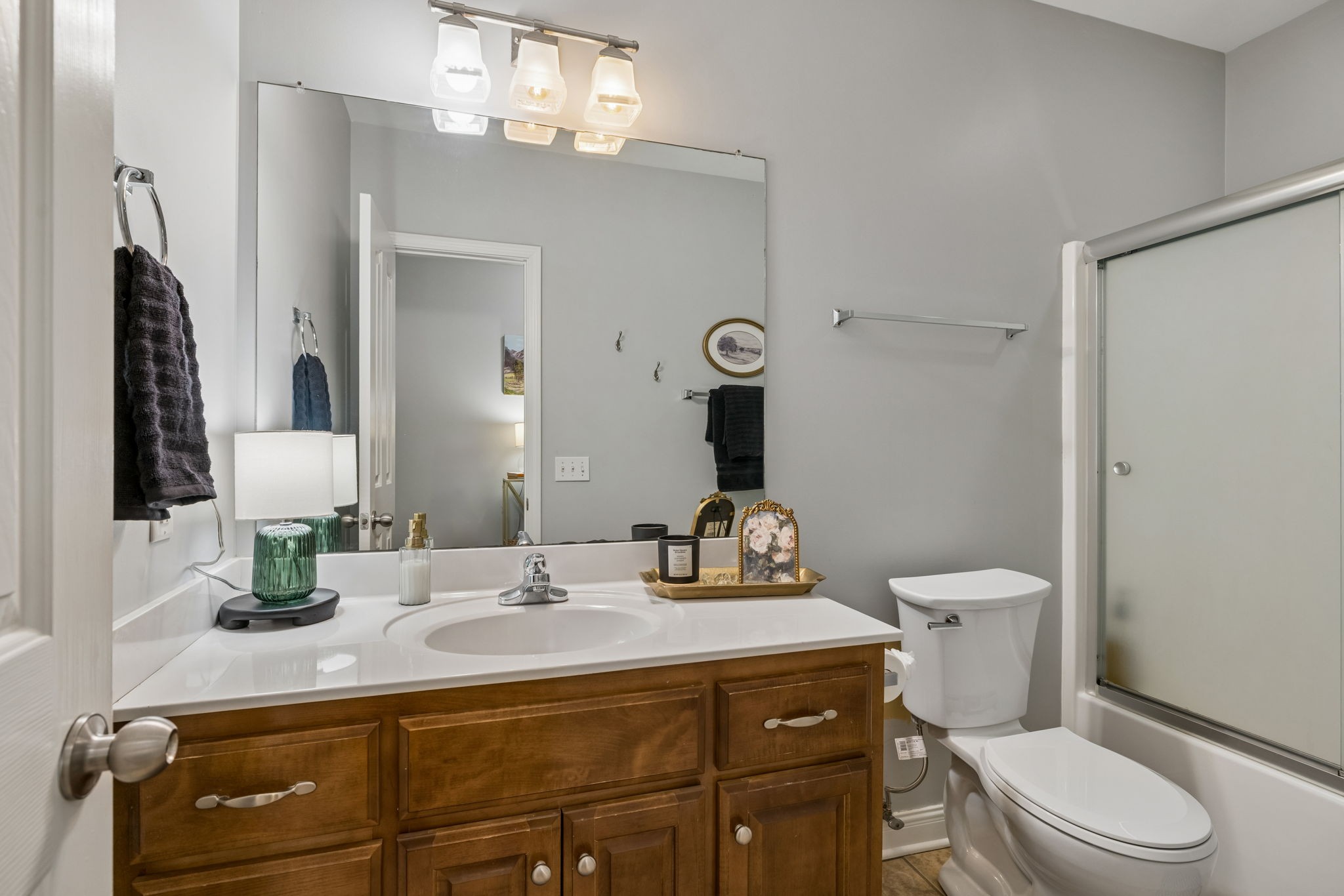 1062 Kacie Drive Pleasant View, TN 37146 - Photo 55 of 67 a bathroom with a granite countertop toilet sink and mirror