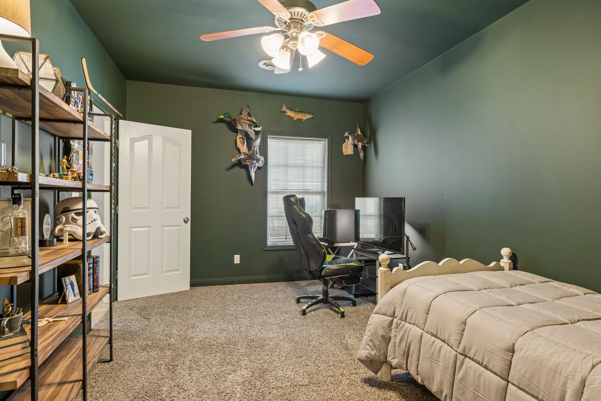 1062 Kacie Drive Pleasant View, TN 37146 - Photo 56 of 67 a bedroom with a bed and a chandelier