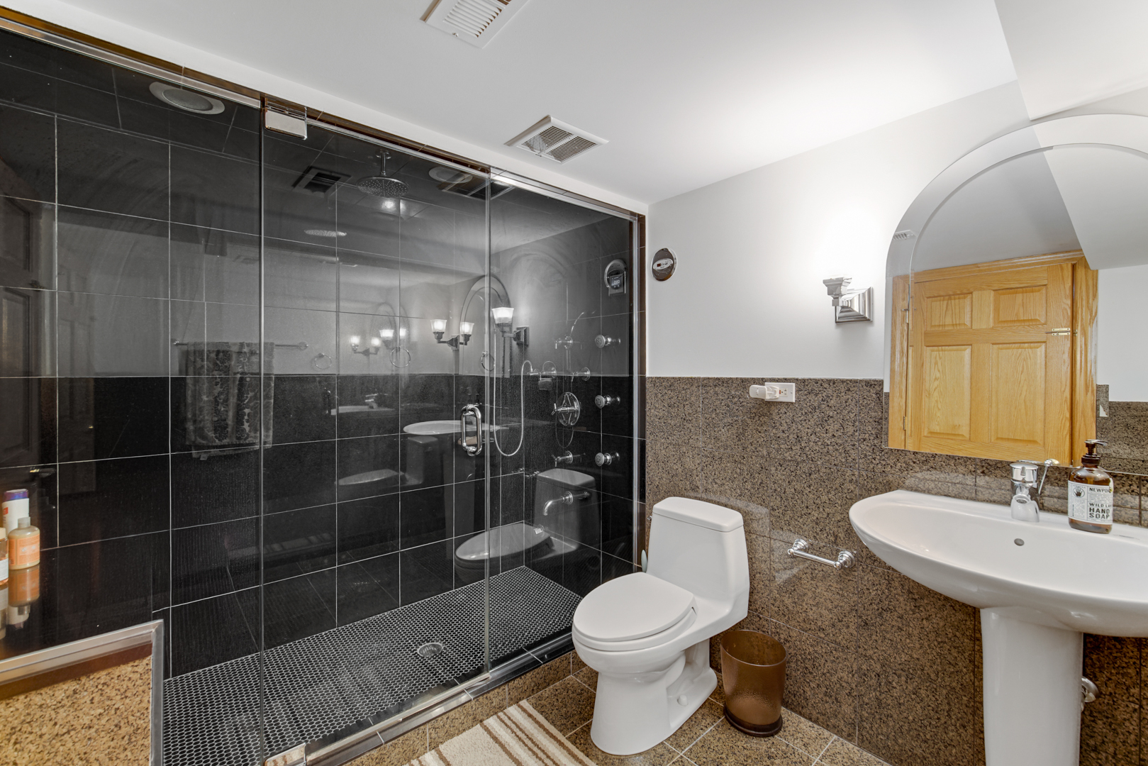 9131 Delphia Street Des Plaines, IL 60016 - Photo 14 of 14 a bathroom with a sink toilet and shower