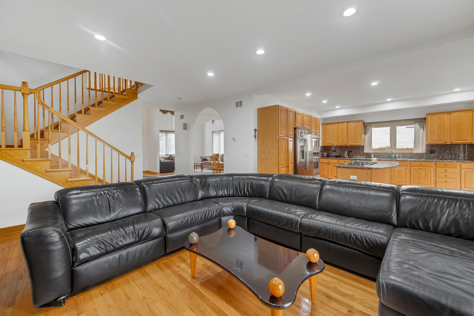 9131 Delphia Street Des Plaines, IL 60016 - Photo 5 of 14 a living room with furniture and a kitchen view