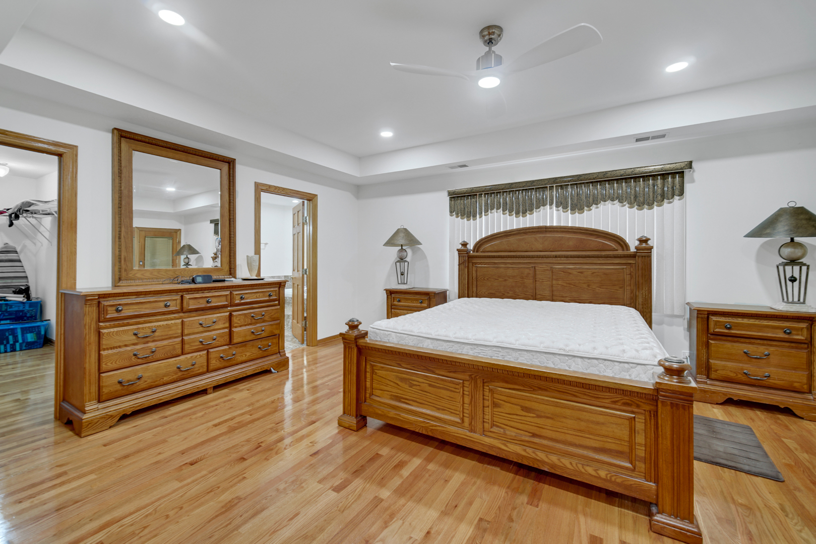 9131 Delphia Street Des Plaines, IL 60016 - Photo 9 of 14 a bedroom with a bed and a dresser