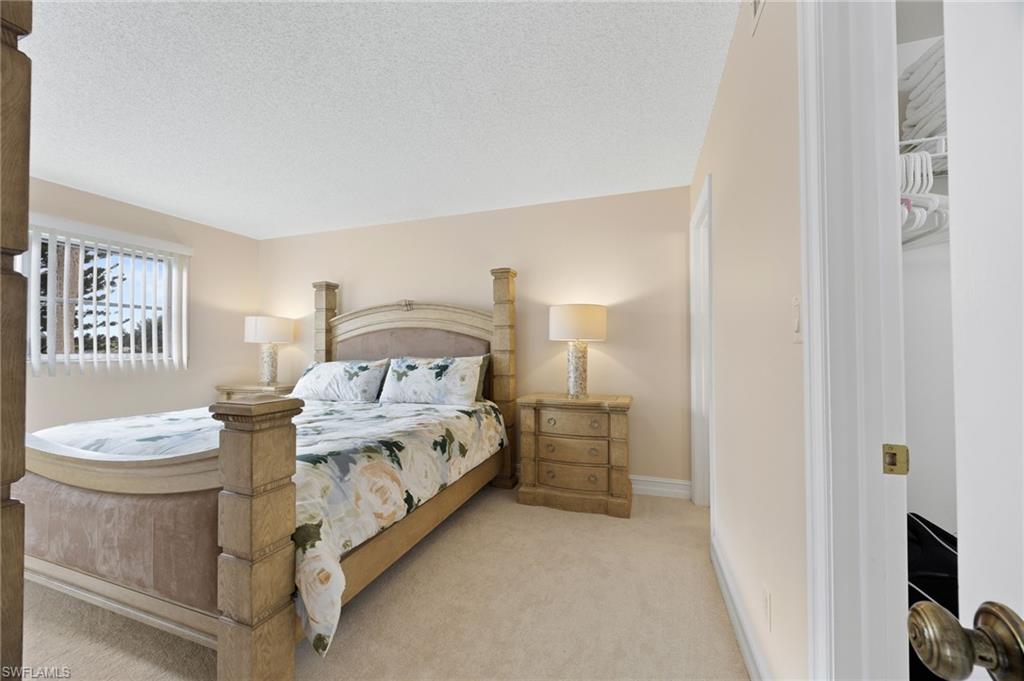 5683 Rattlesnake Hammock Road, Unit A202 Naples, FL 34113 - Photo 9 of 19 King size bed
