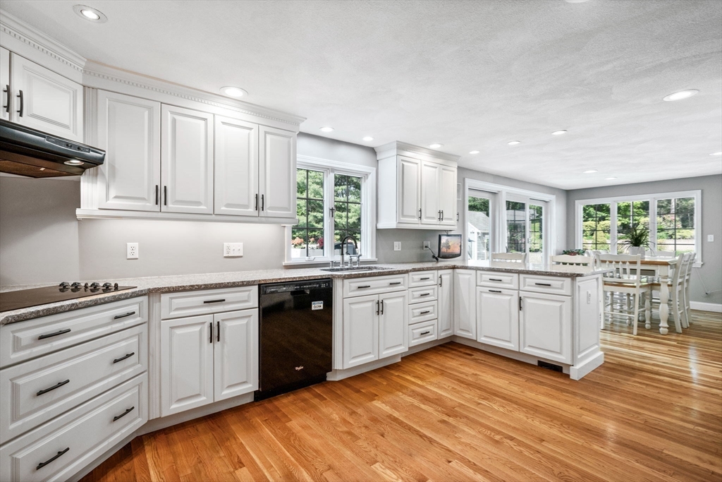 20 Stagecoach Road Topsfield, MA 01983 - Photo 14 of 42 a kitchen with white cabinets sink and window