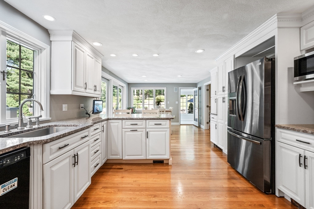 20 Stagecoach Road Topsfield, MA 01983 - Photo 15 of 42 a kitchen with granite countertop a refrigerator stove top oven and sink