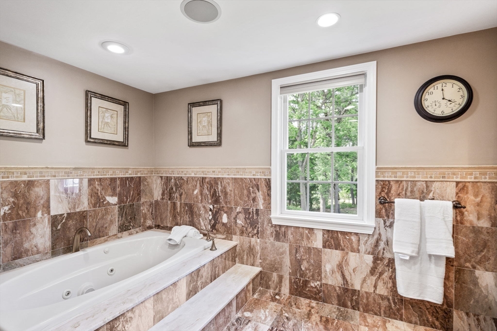 20 Stagecoach Road Topsfield, MA 01983 - Photo 27 of 42 a bathroom with a bathtub and a window