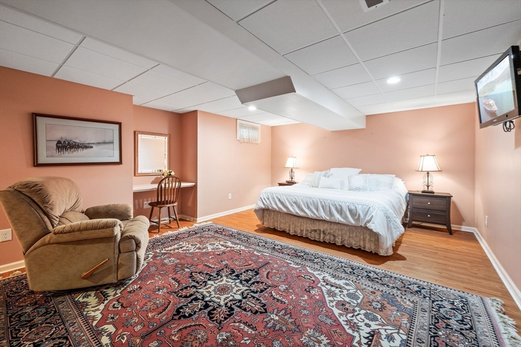 20 Stagecoach Road Topsfield, MA 01983 - Photo 36 of 42 a bedroom with a large bed and a couch