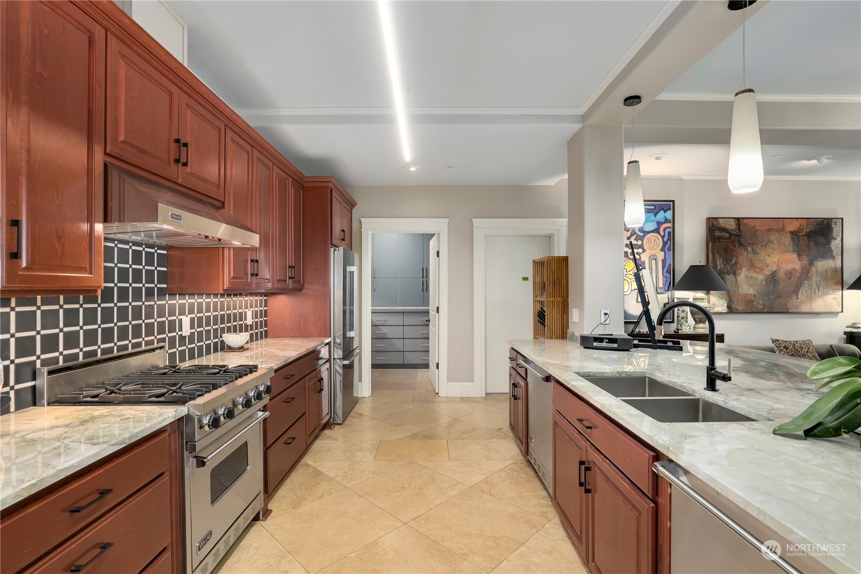 207 Broadway, Unit 500 Tacoma, WA 98402 - Photo 12 of 40 a kitchen with stainless steel appliances granite countertop a sink stove and cabinets