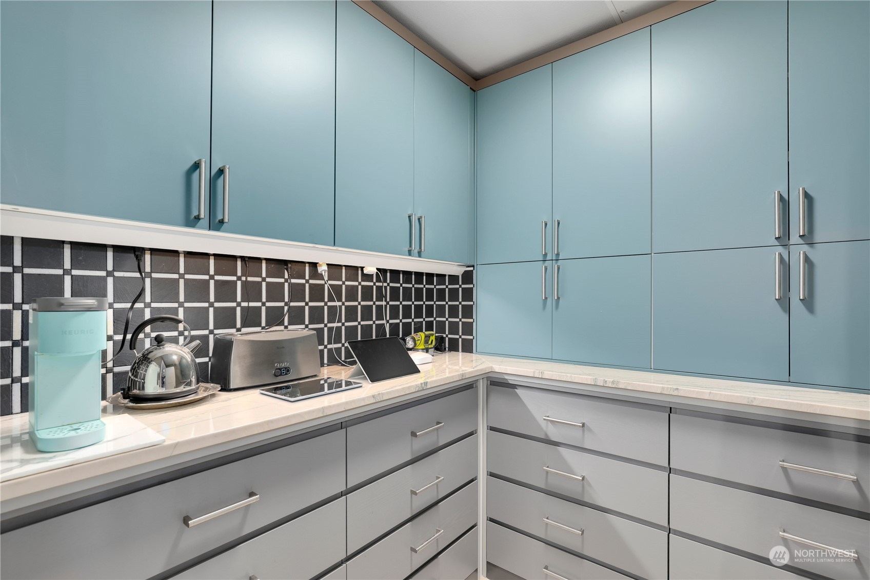 207 Broadway, Unit 500 Tacoma, WA 98402 - Photo 17 of 40 a kitchen with a sink and cabinets
