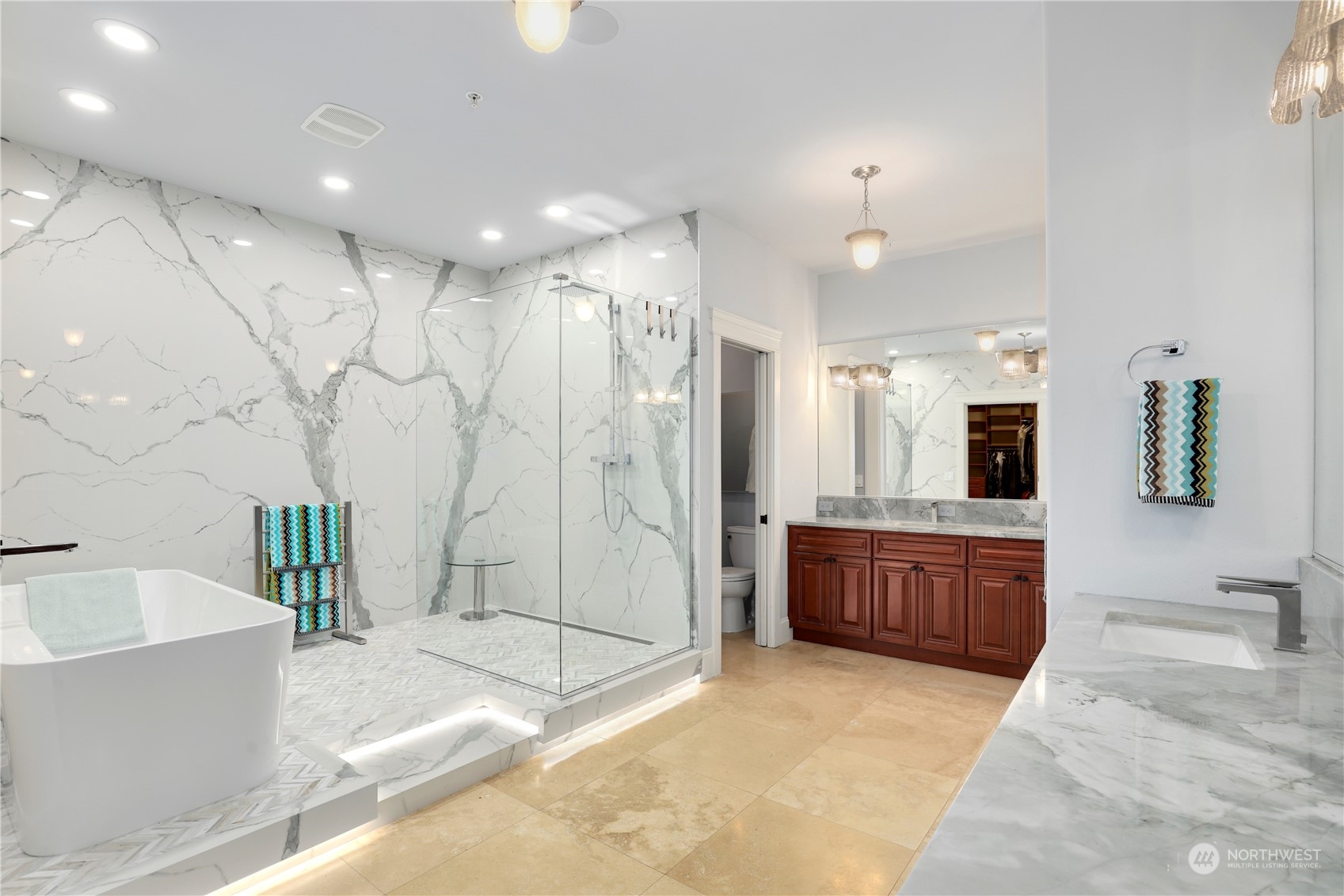 207 Broadway, Unit 500 Tacoma, WA 98402 - Photo 22 of 40 a bathroom with a granite countertop tub sink shower and mirror