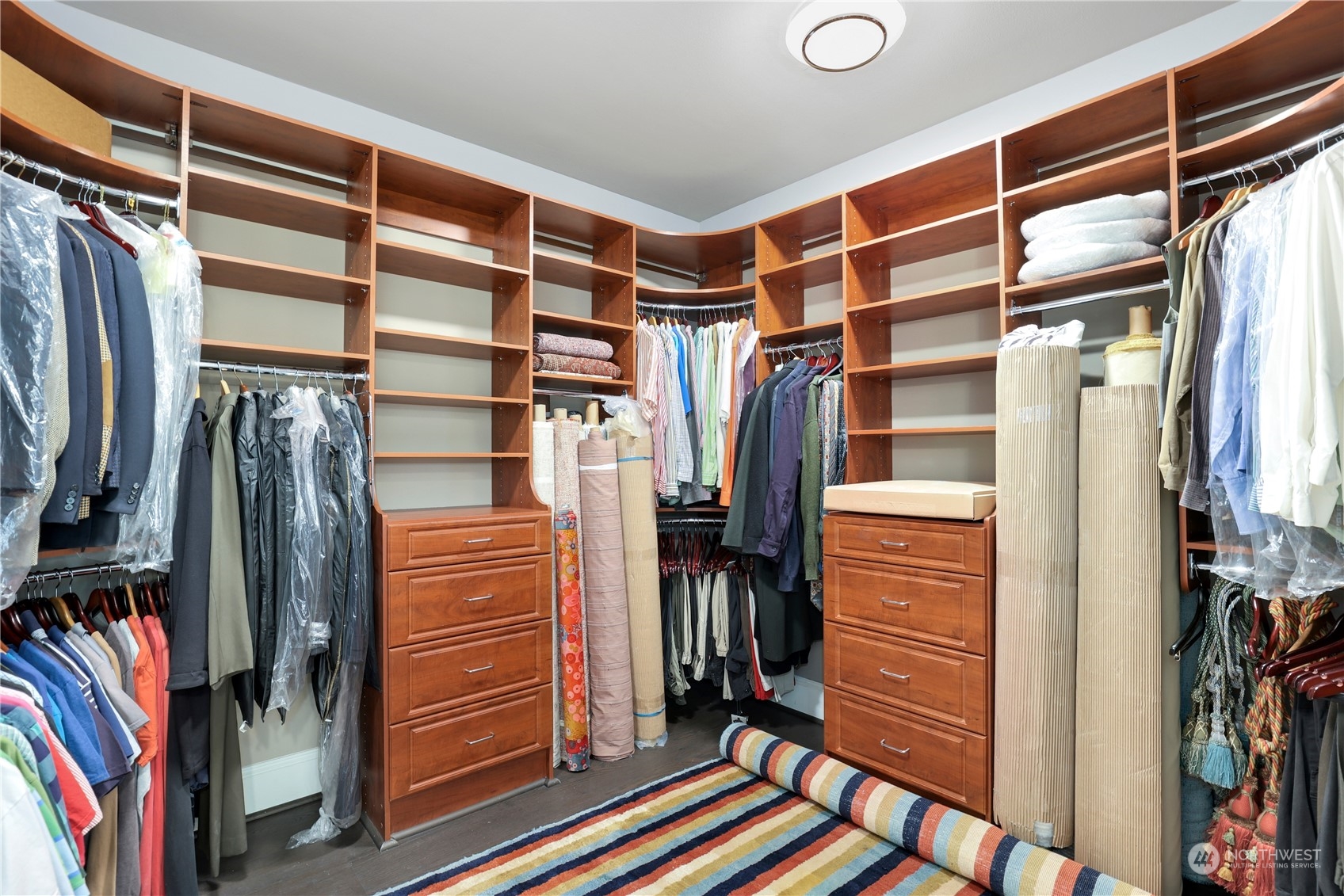 207 Broadway, Unit 500 Tacoma, WA 98402 - Photo 25 of 40 a view of walk in closet with clothes and shoes