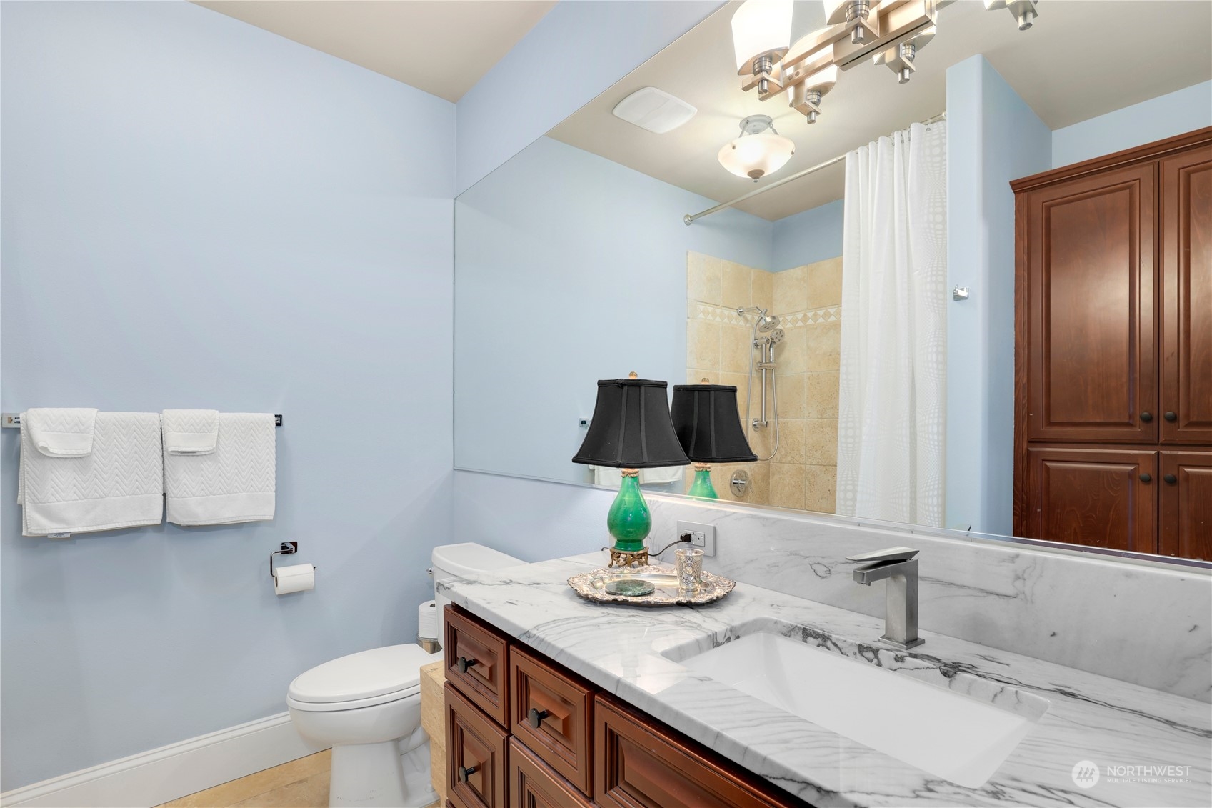 207 Broadway, Unit 500 Tacoma, WA 98402 - Photo 30 of 40 a bathroom with a sink and a mirror