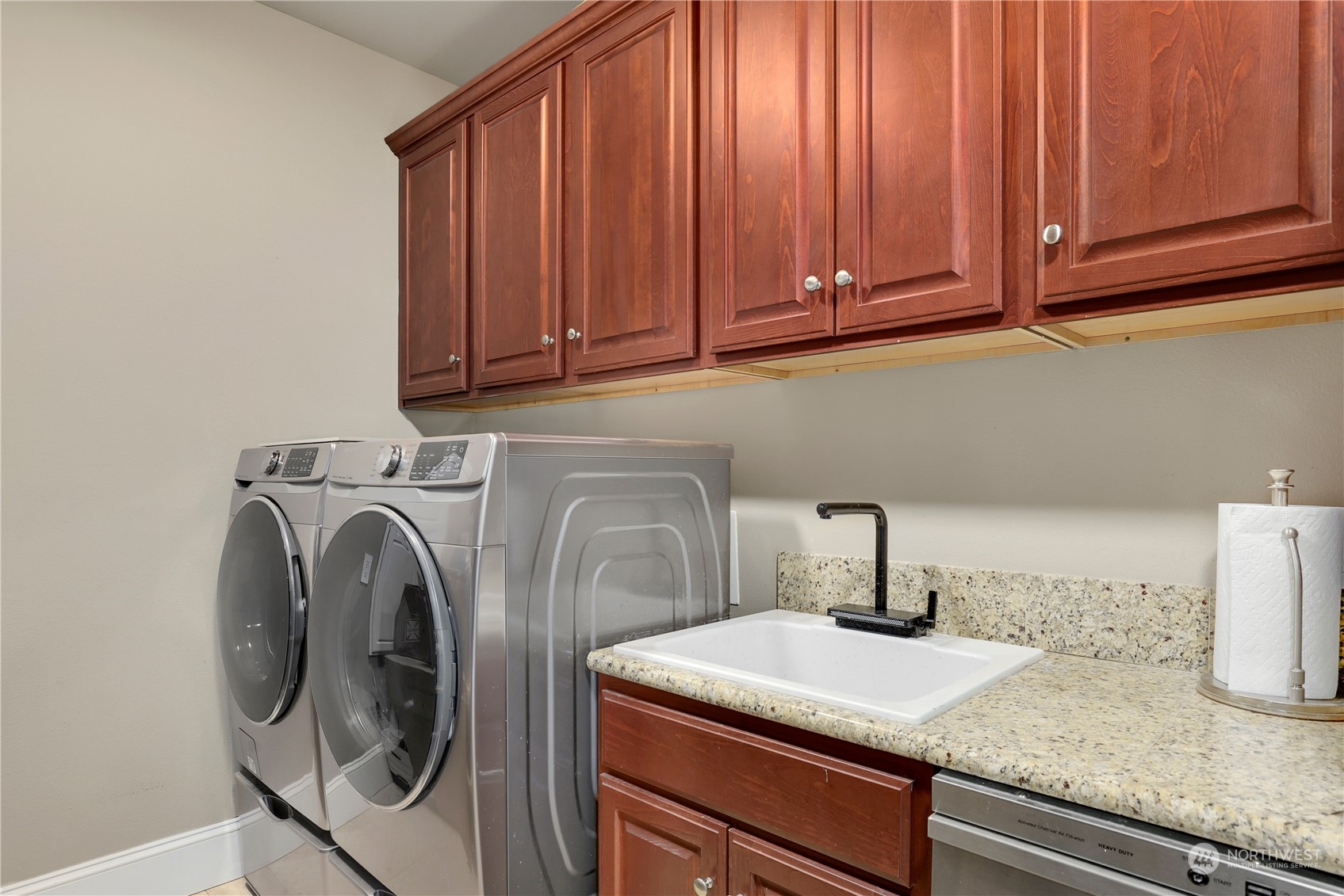 207 Broadway, Unit 500 Tacoma, WA 98402 - Photo 33 of 40 a utility room with sink dryer and washer