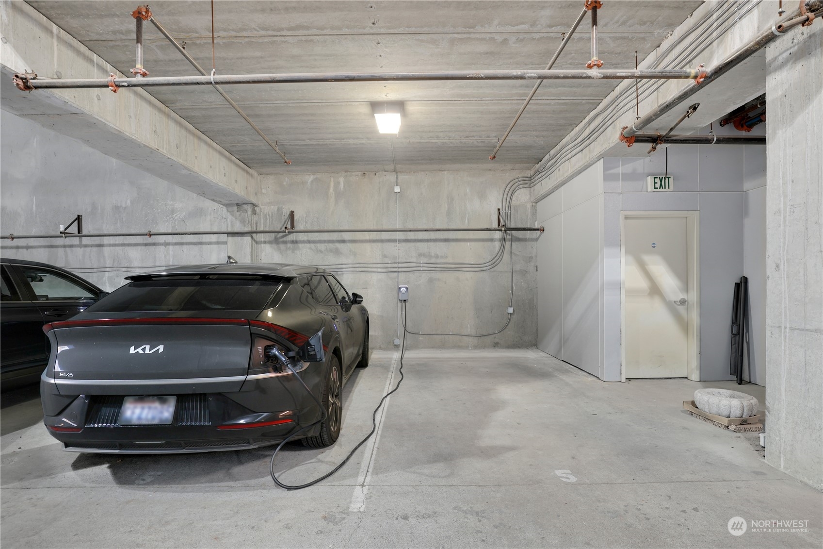 207 Broadway, Unit 500 Tacoma, WA 98402 - Photo 35 of 40 a car parked in a garage