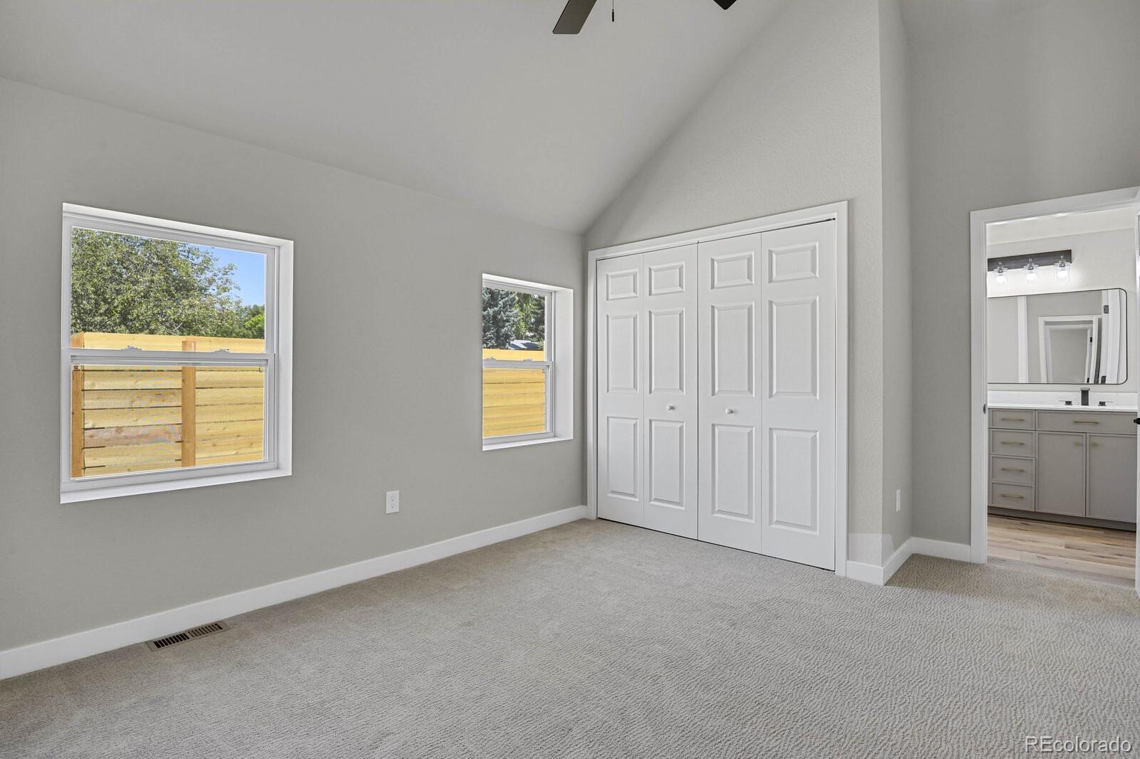 407 Hover Street Longmont, CO 80503 - Photo 13 of 39 a view of an empty room with a window