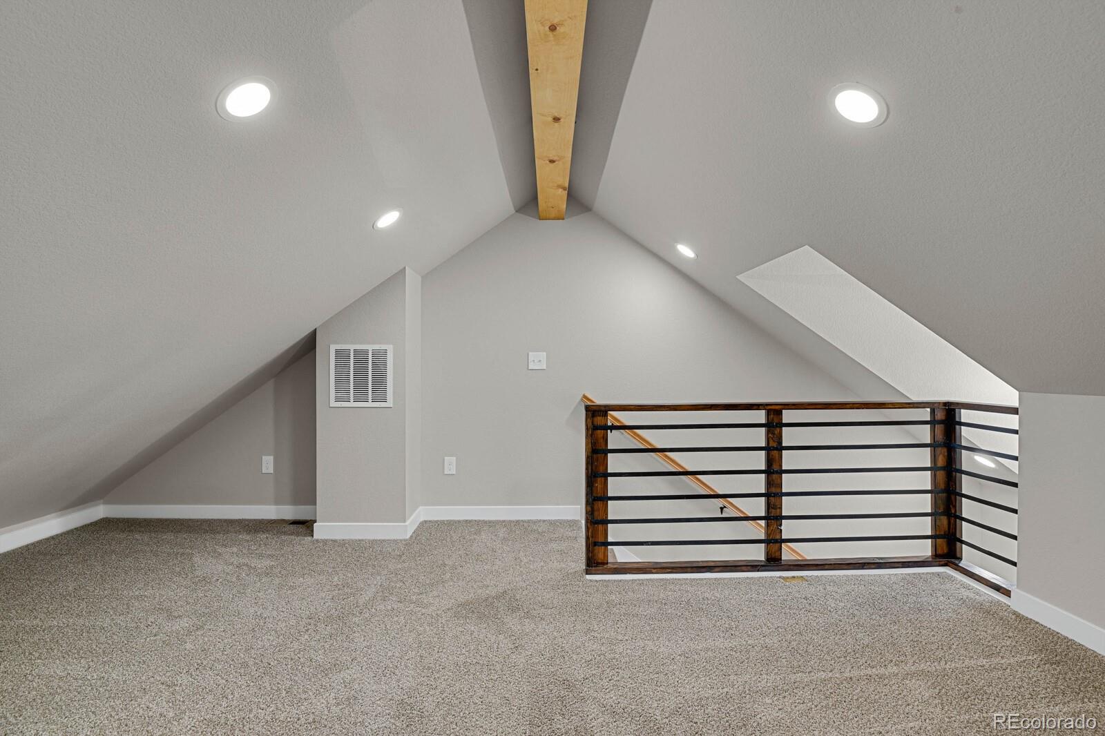 407 Hover Street Longmont, CO 80503 - Photo 23 of 39 a view of an empty room with stairs and a window