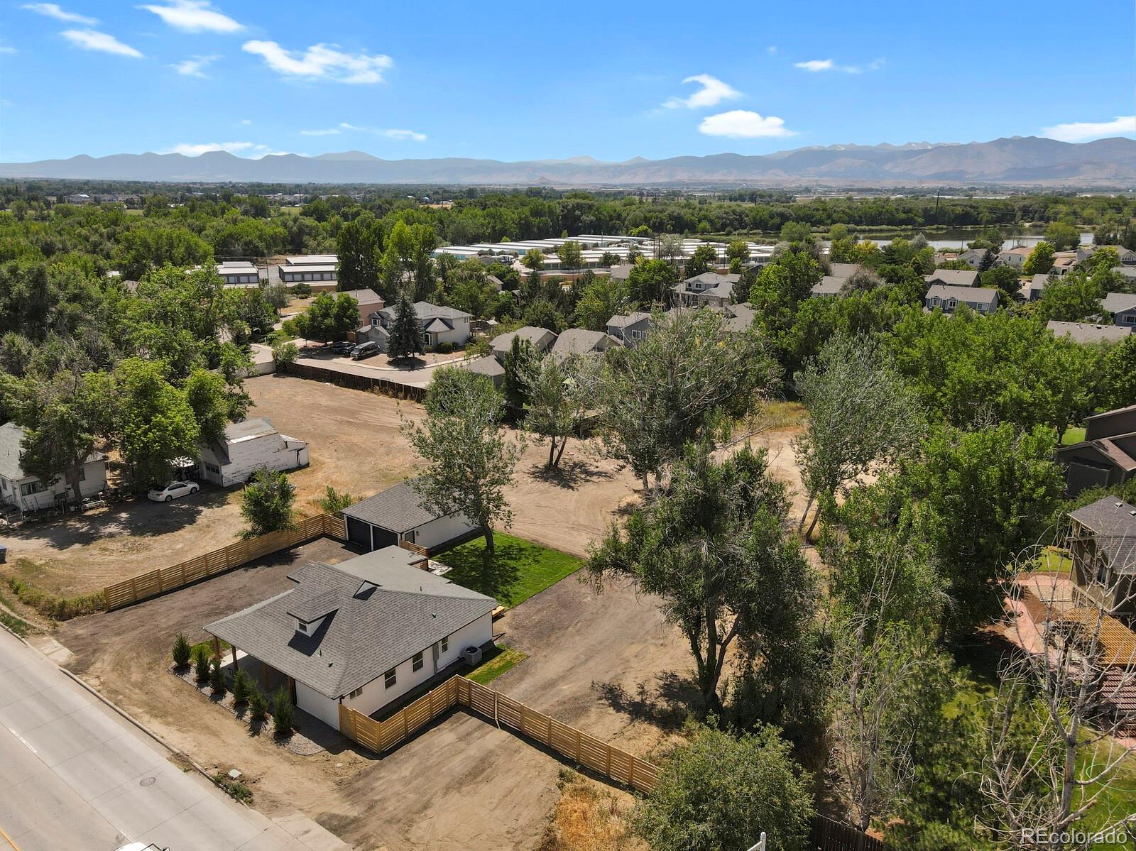 407 Hover Street Longmont, CO 80503 - Photo 33 of 39 an aerial view of a house with a lake view