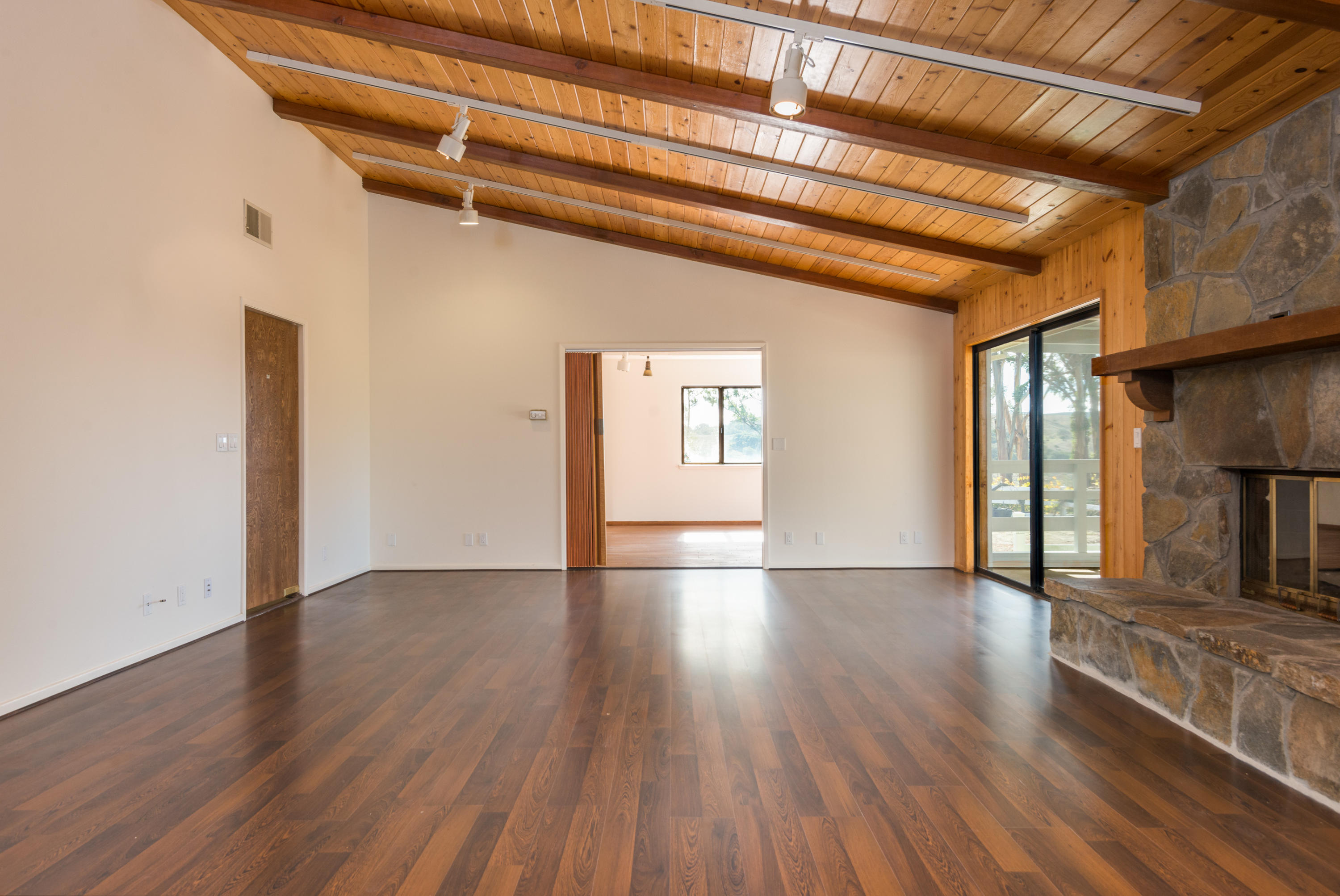 1815 Tularosa Road Lompoc, CA 93436 - Photo 12 of 35 a view of an empty room with wooden floor and a window