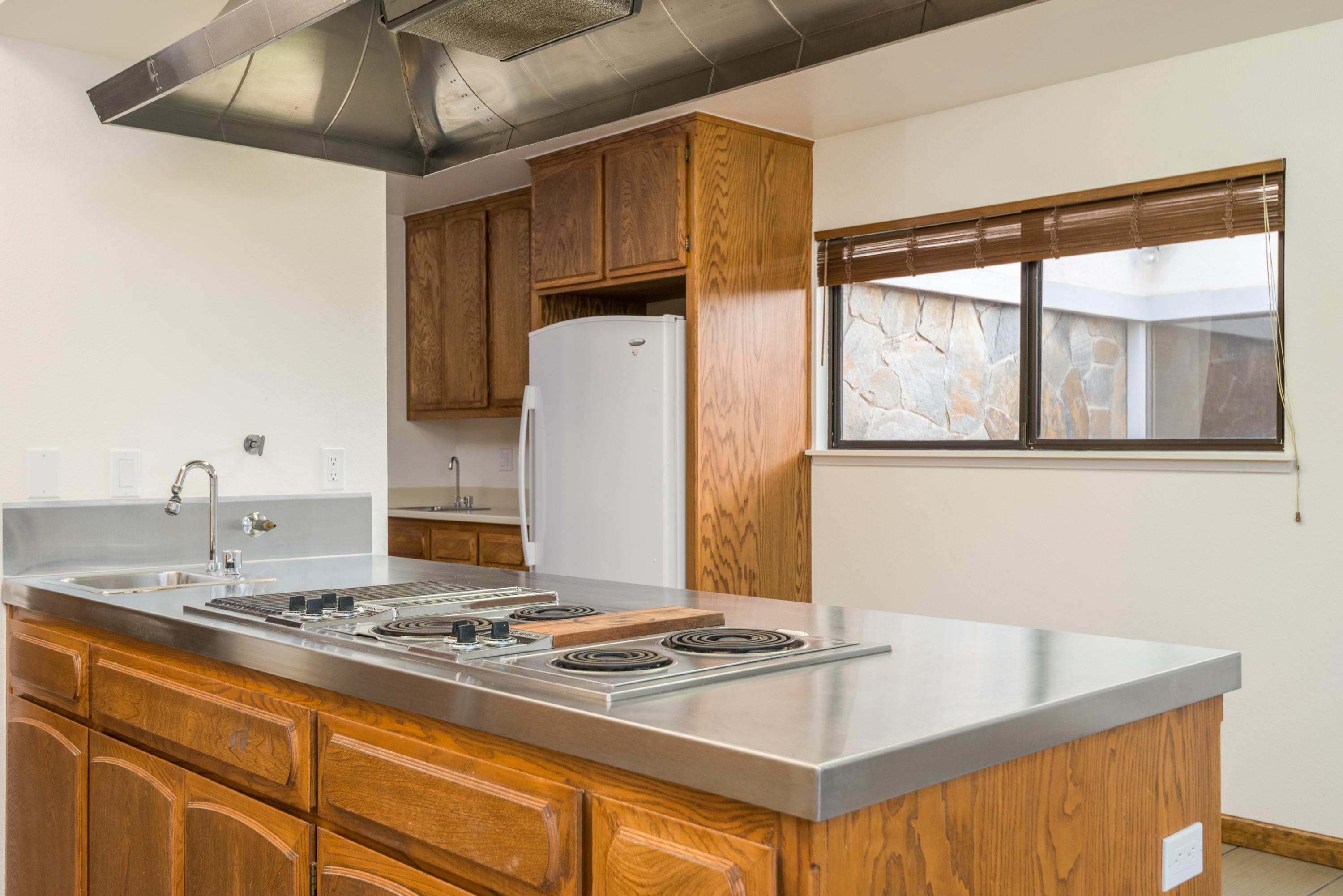 1815 Tularosa Road Lompoc, CA 93436 - Photo 25 of 35 a kitchen with stainless steel appliances granite countertop a sink stove and refrigerator