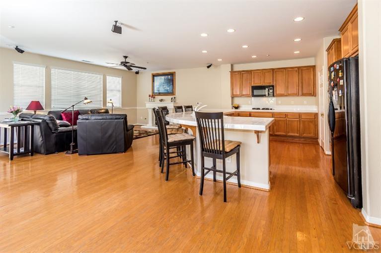 9898 Rhone Street Ventura, CA 93004 - Photo 17 of 44 a view of kitchen dining space with furniture and wooden floor