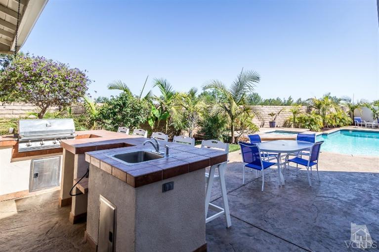 9898 Rhone Street Ventura, CA 93004 - Photo 2 of 44 a table and chairs in a patio