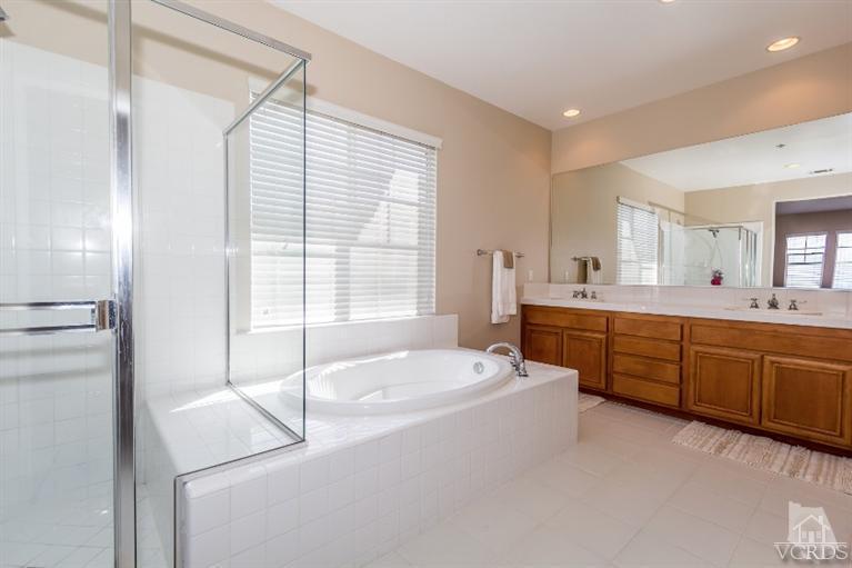 9898 Rhone Street Ventura, CA 93004 - Photo 24 of 44 a spacious bathroom with sink shower and mirror