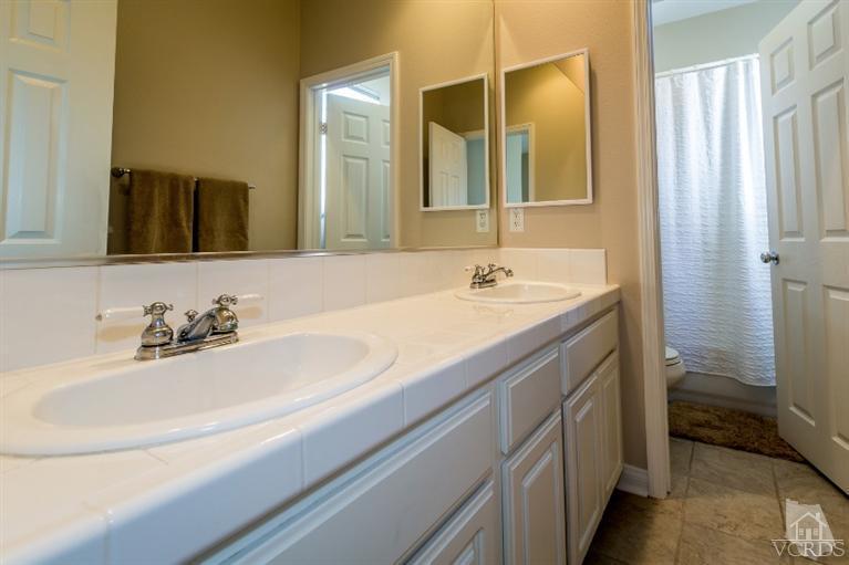 9898 Rhone Street Ventura, CA 93004 - Photo 29 of 44 a bathroom with a sink and a mirror