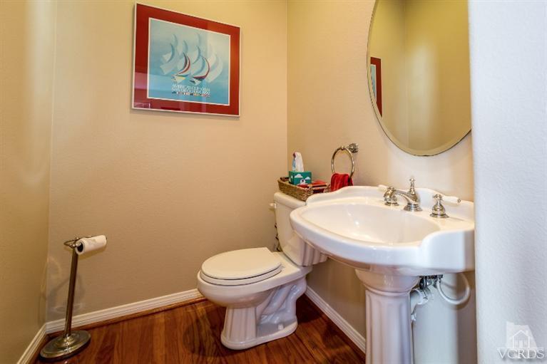9898 Rhone Street Ventura, CA 93004 - Photo 30 of 44 a bathroom with a sink and a mirror
