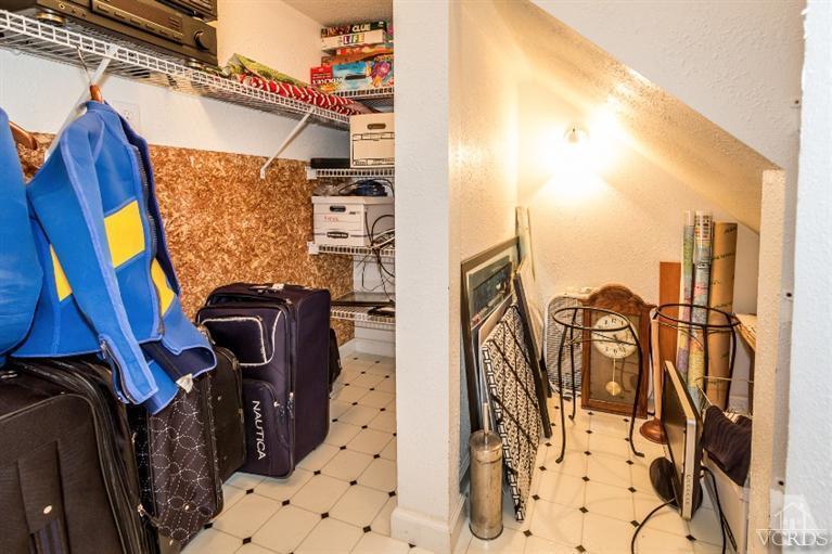 9898 Rhone Street Ventura, CA 93004 - Photo 31 of 44 a view of walk in closet with clothes and shoes