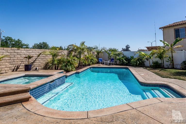 9898 Rhone Street Ventura, CA 93004 - Photo 32 of 44 a view of a swimming pool with a yard