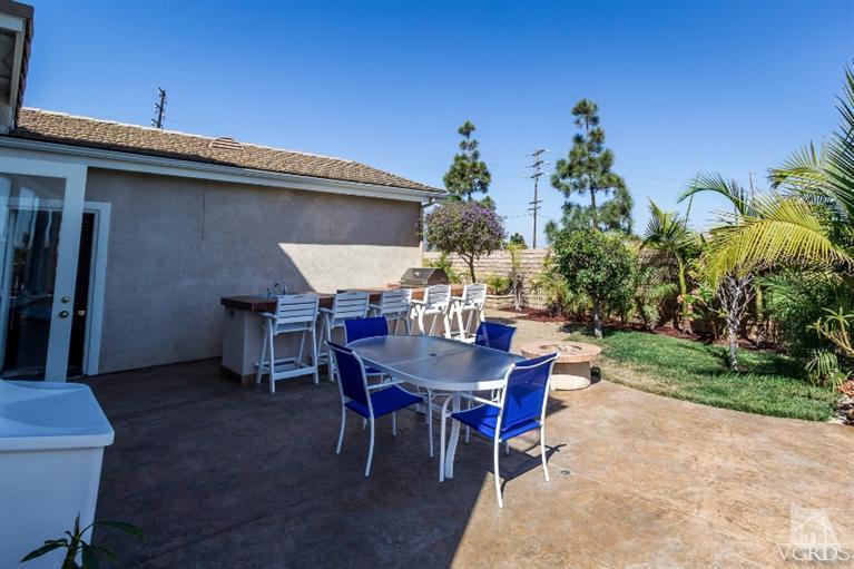 9898 Rhone Street Ventura, CA 93004 - Photo 39 of 44 a view of a dinning table and chairs in patio