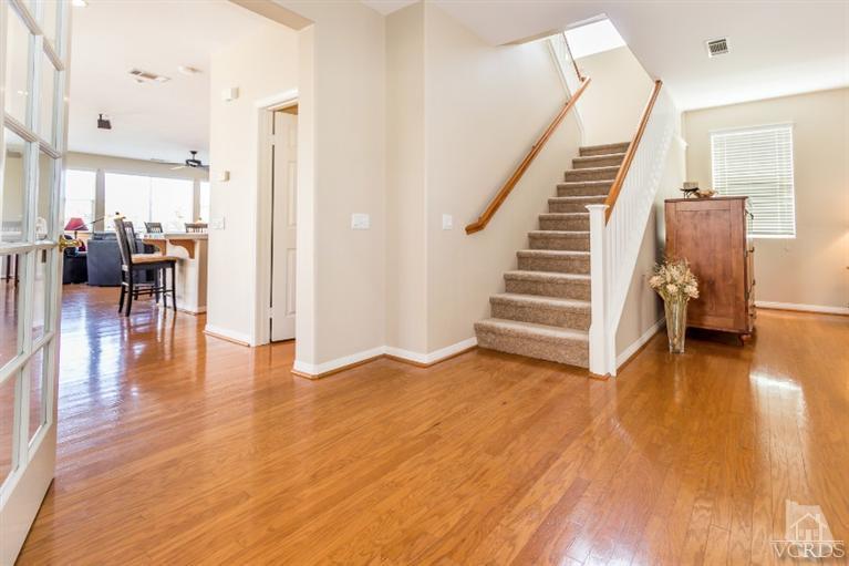 9898 Rhone Street Ventura, CA 93004 - Photo 7 of 44 a view of a livingroom with wooden floor and stairs