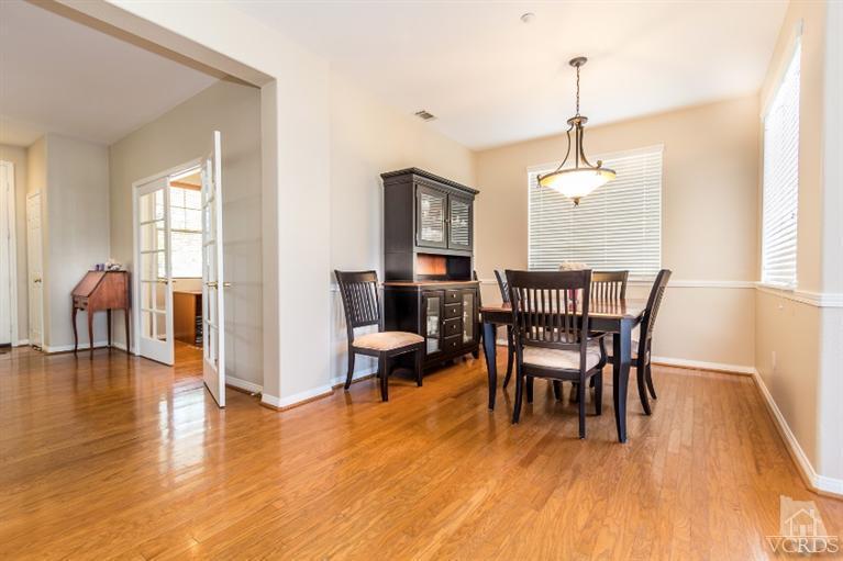 9898 Rhone Street Ventura, CA 93004 - Photo 9 of 44 a view of a dining room with furniture window and wooden floor