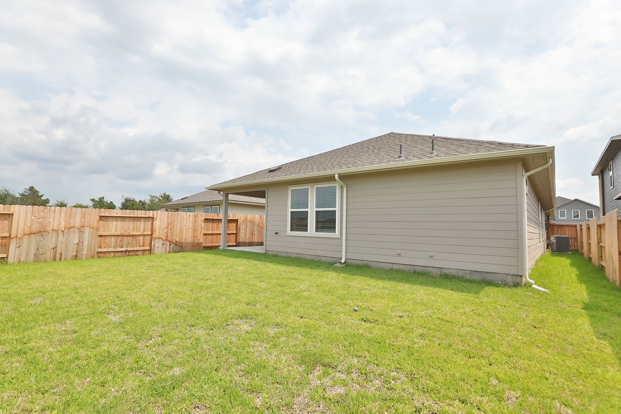14110 Greystone Ter Street Magnolia, TX 77354 - Photo 25 of 34 The Backyard Is A Blank Slate, Perfect For Playing A Game Of Catch. Note That The Home Has Full Gutters For Better Water Management. Additionally, The Home Is High And Dry, Well Out Of Any Designated Flood Plains.