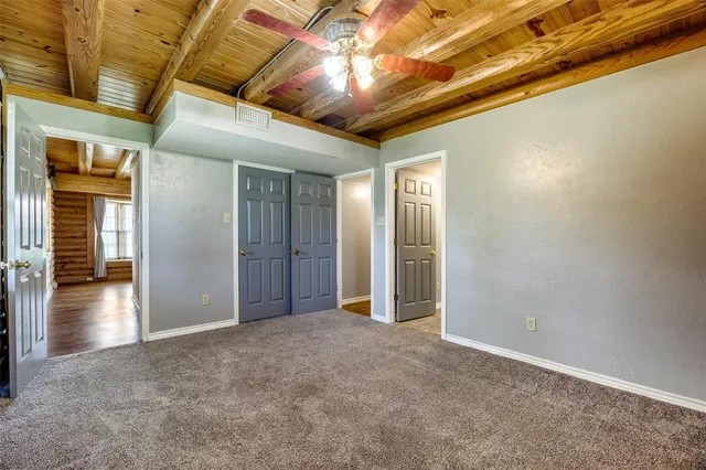 a view of hallway with wooden floor